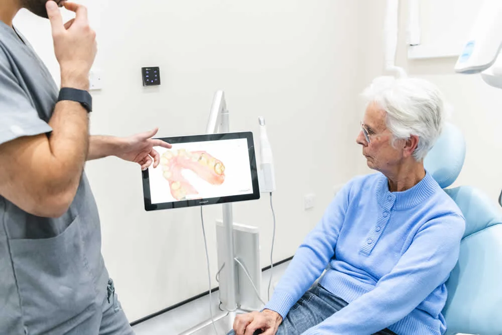 Dentist explaining treatment to a patient at Didcot Dental Studio